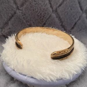 Gold hair tie holding bracelet